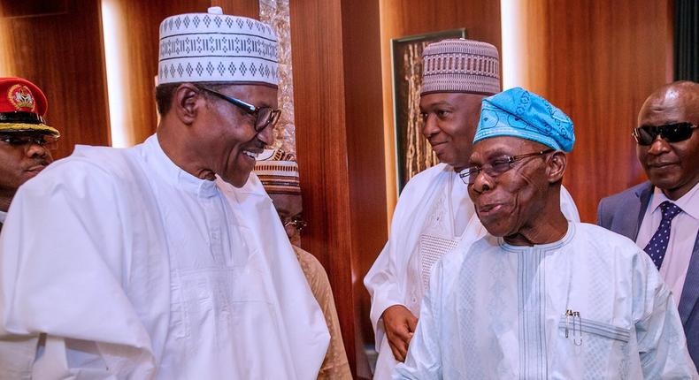 President Muhammadu Buhari shakes hands with former president, Olusegun Obasanjo [Twitter/@NGRPresident]