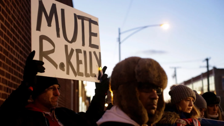 Many protesters positioned themselves in front of Sony Musicâ€™s New York City headquarters on Wednesday to ask the label to drop R. Kelly. [Joshua Lott/Reuters]