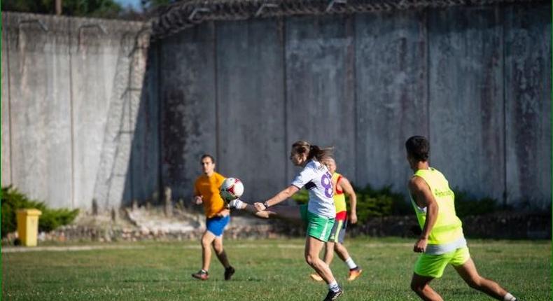 Female and male prisoners play football at Spain's Teixeiro Prison