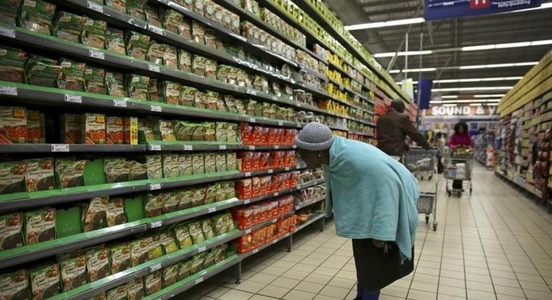 A shopper browses in a branch of South African retailer Pick n Pay at a mall in Soweto, southwest of Johannesburg August 4, 2014. REUTERS/Siphiwe Sibeko