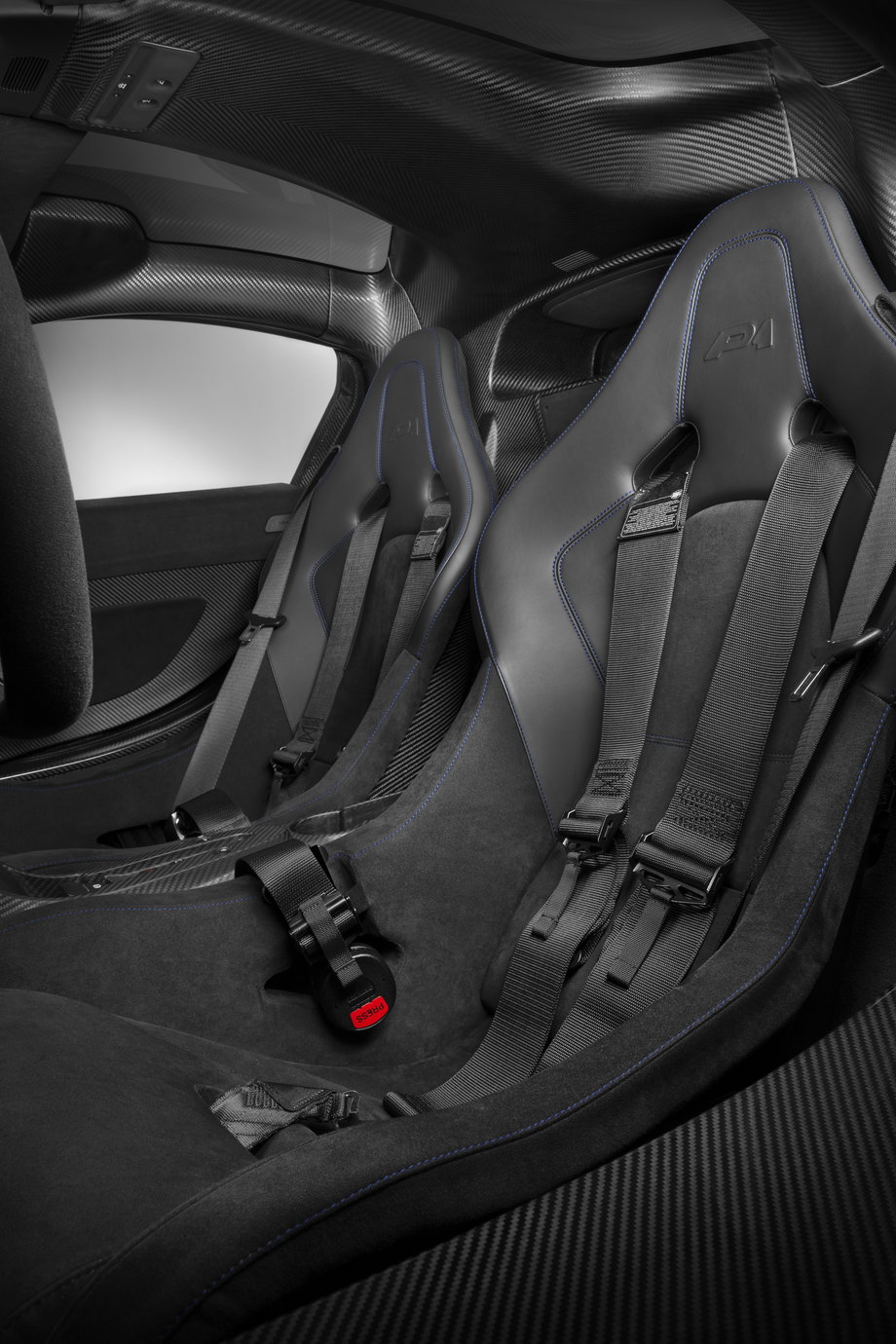 The color is also repeated in contrast stitching on the seats. Buckle up because ...