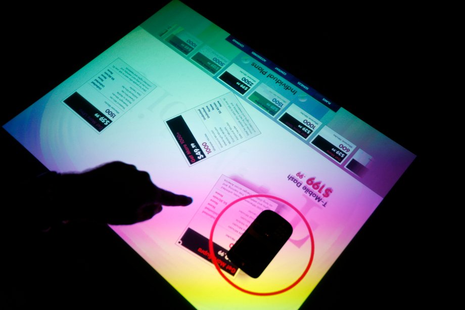 The Surface 1.0 was a 30-inch table that could recognize items, like phones, on it. In this demo, placing a phone on the table brings up pricing and other information about it.