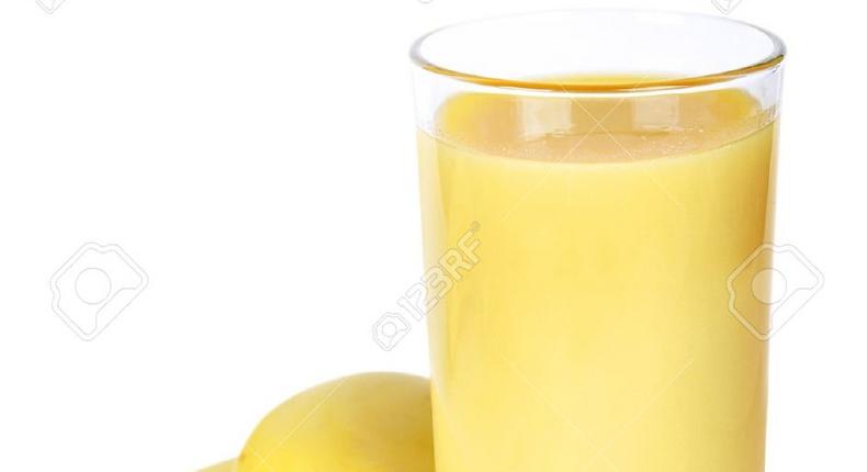 ___4576724___https:______static.pulse.com.gh___webservice___escenic___binary___4576724___2016___1___19___12___13911956-Banana-smoothie-inl-glass-on-white-background-Stock-Photo-juice