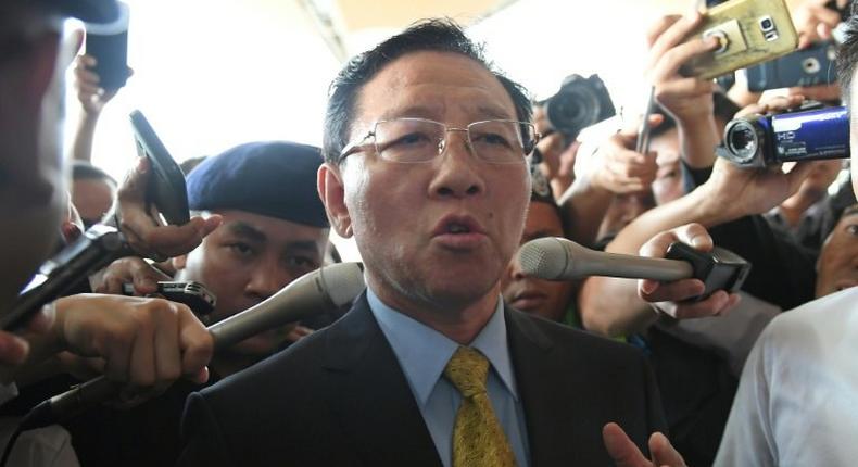 Pyongyang has responded to the expulsion of its ambassador Kang Chol (C) from Kuala Lumpur by banning all Malaysian citizens from leaving North Korea