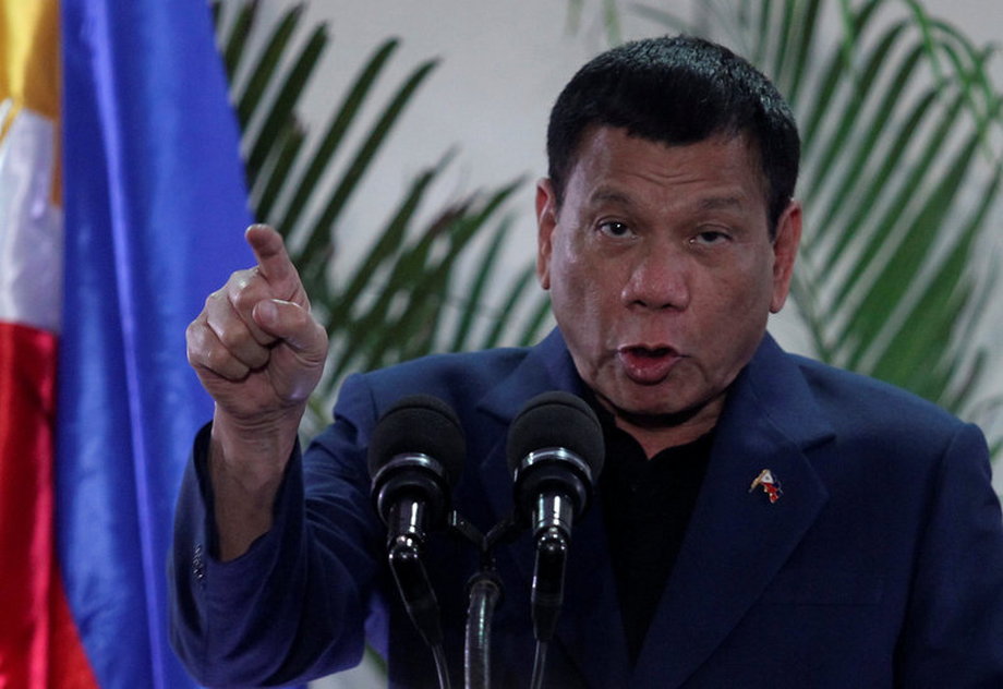 Philippine President Rodrigo Duterte speaks to reporters during a news conference upon his arrival from a four-day state visit in China at the Davao International Airport in Davao City.