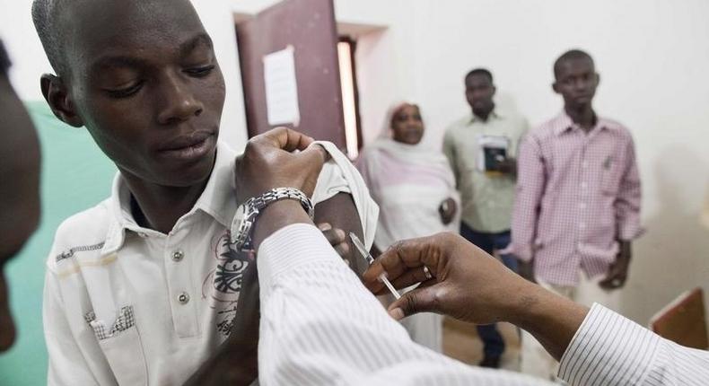 Staff members of Teaching Hospital receive the first vaccination treatment for yellow fever in El Geneina, West Darfur in this November 14, 2012 handout. 