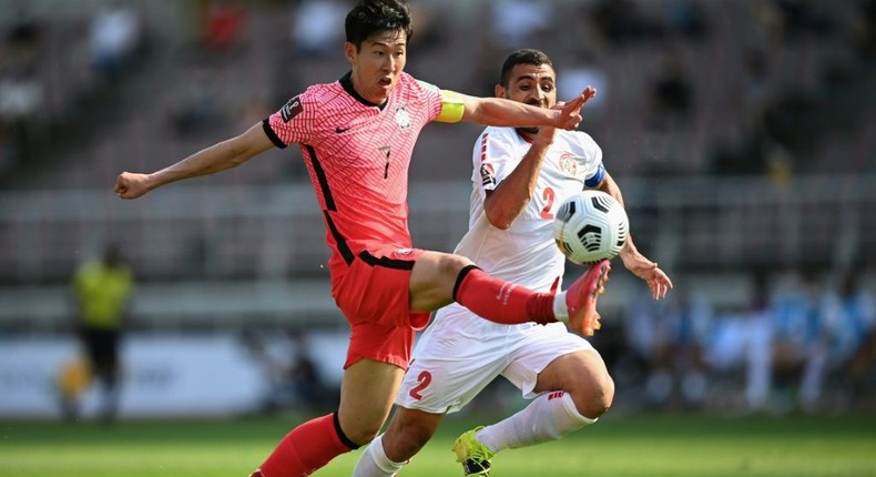 South Korea's Son Heung-min (L) and Lebanon's Kassem El Zein compete for the ball Creator: Jung Yeon-je