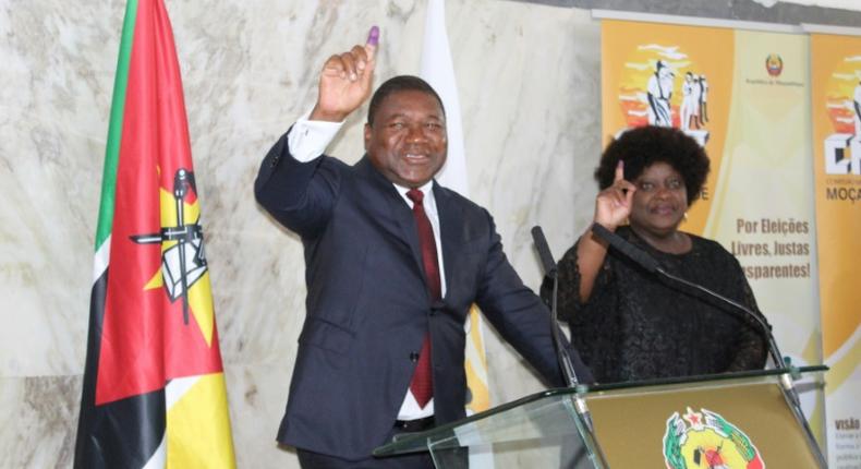 Mozambican President Felipe Nyusi (L) won a new five-year term in the election, though the opposition claimed massive fraud