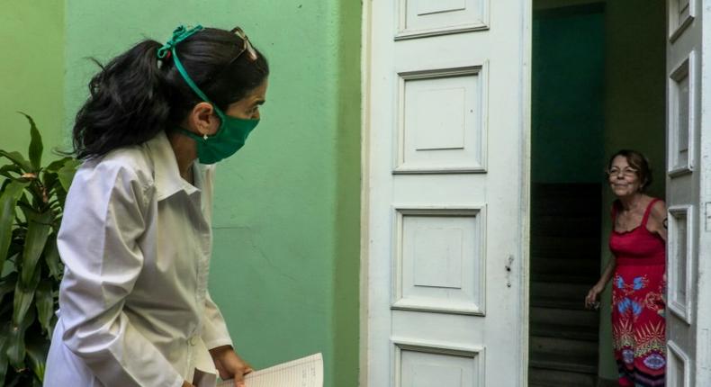 Cuban doctor Liz Caballero goes door-to-door in Havana on March 31 looking for possible cases of coronavirus