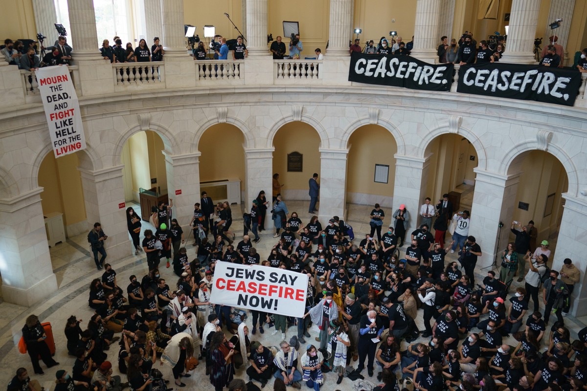 Jewish group protests Israel's expected ground assault on Gaza in the Cannon House Office Building