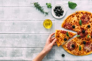 colorful tasty pizza. woman taking piece of italian pizza