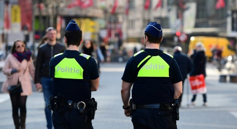 Policemen patrol in the Belgian city of Antwerp on March 23, 2017