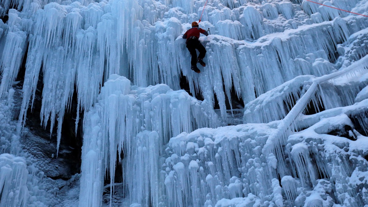 A man climbs an artificial wall of ice in the city of Liberec