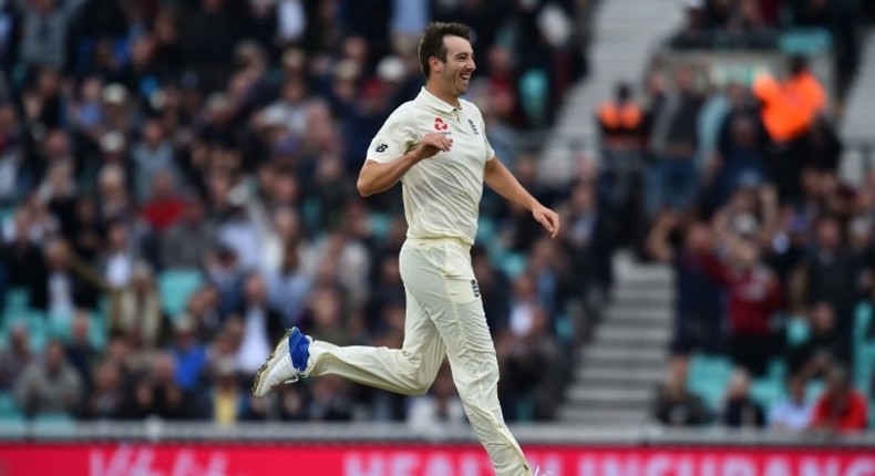 England's Toby Roland-Jones celebrates the wicket of South Africa's Hashim Amla for 6 runs on July 28, 2017