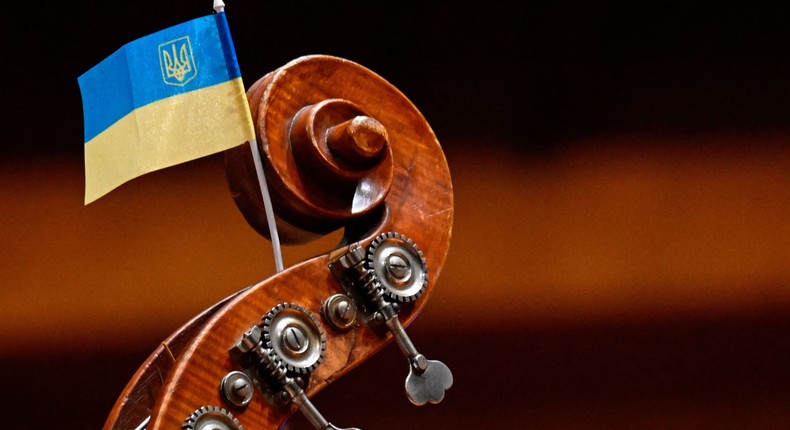 A Ukraine flag is fixed on the headstock of a string bass of the Kyiv Symphony Orchestra.