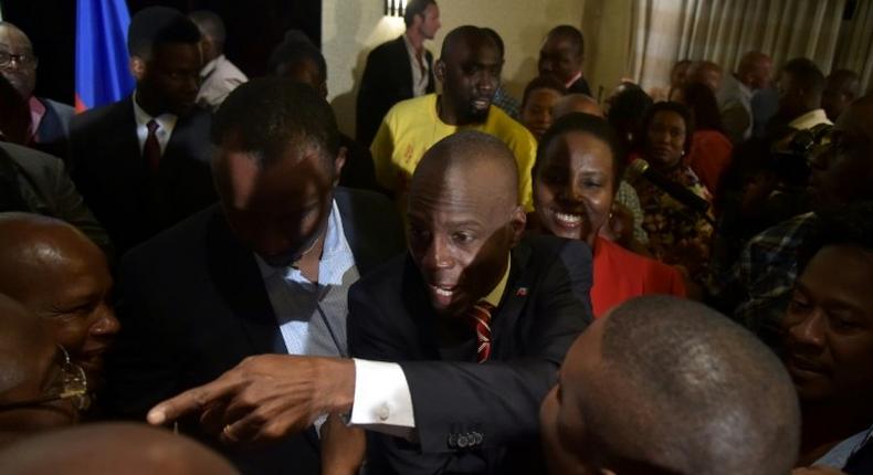 Elected President Jovenel Moise (C) of the PHTK party, greets supporters after speaking to the nation, in the Haitian capital Port-au-Prince