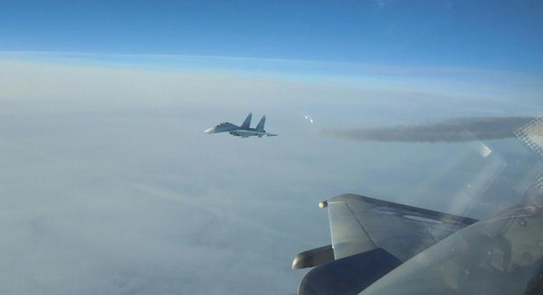 Undated picture released on December 15, 2016 by the French military account @EtatMajorFR shows a Russian jet being intercepted by a French Mirage jet in Baltic Sea air space above Lithuania