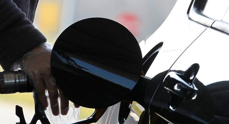 A driver pumps petrol into his car at a petrol station in Brussels, file.    REUTERS/Yves Herman