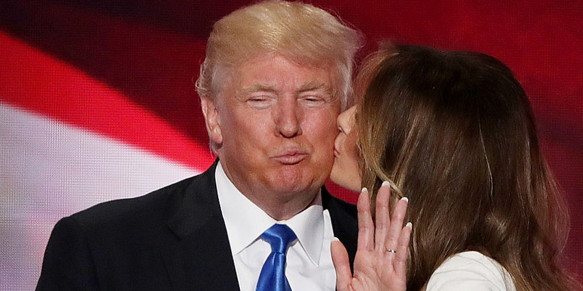 Melania Trump kisses her husband Donald Trump, after delivering a speech on the first day of the Republican National Convention.