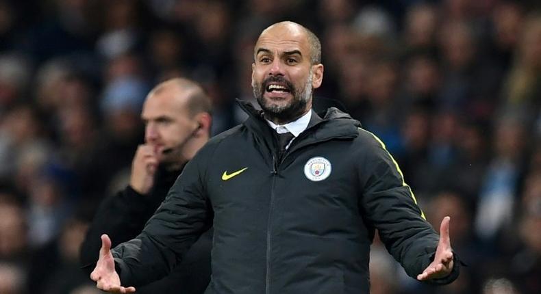 Manchester City's Spanish manager Pep Guardiola gestures on the touchline during the English Premier League football match between Manchester City and Arsenal at the Etihad Stadium in Manchester, north west England, on December 18, 2016