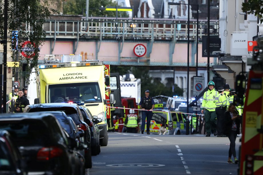 An ambulance and police officers outside Parsons Green station on Friday morning.