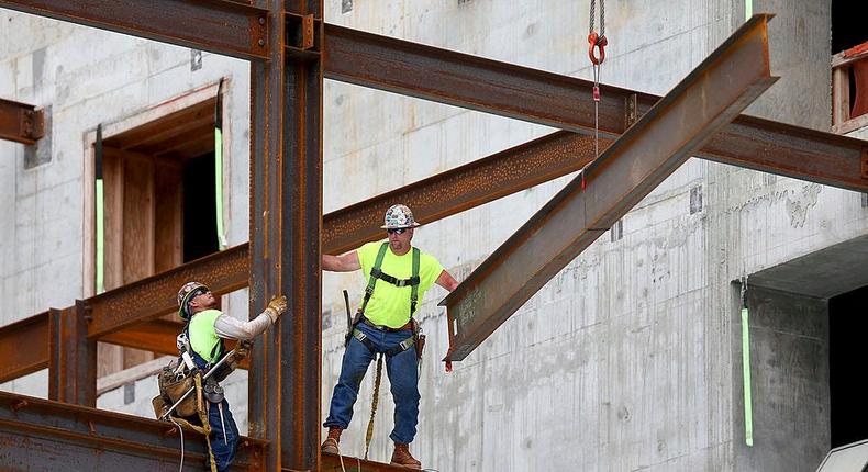 Construction workers build the $1.05 billion Brickell CityCentre condo/retail mix use complex on July 7, 2014 in Miami, Florida. Condo projects are booming in the South Florida area as foreign investors pour money into the new residences being built.Joe Raedle/Getty