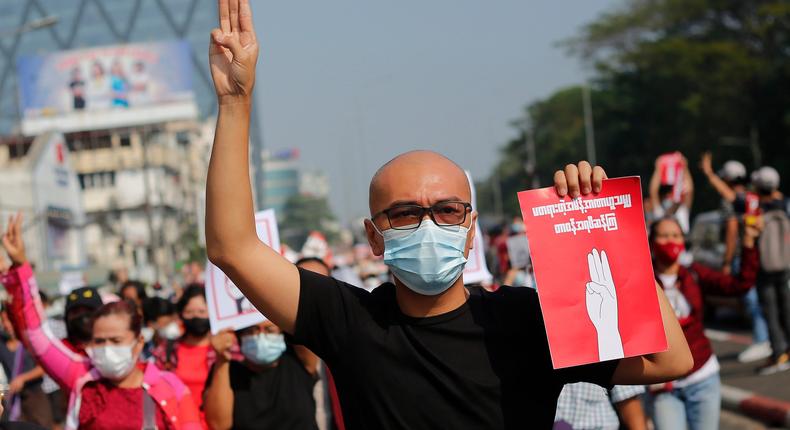 A Myanmar protester makes the three finger salute during a demonstration against military coup in Yangon, Myanmar on February 7, 2021.
