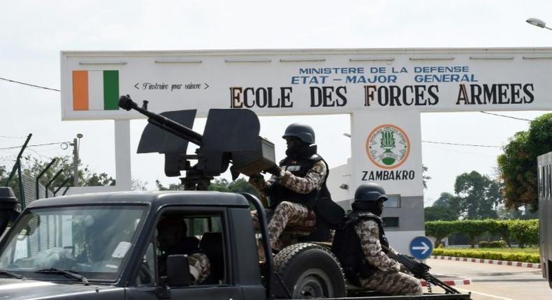 Ivory Coast's main port of Abidjan, one of Africa's biggest, was shut down when angry security forces began firing into the air amid protests by mutinous troops