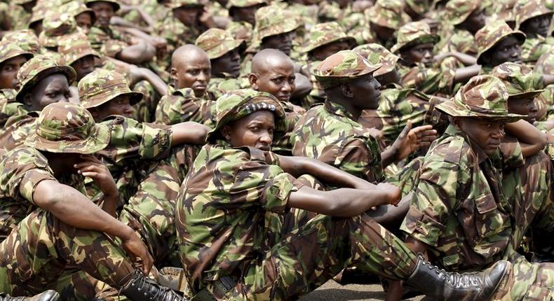 Members of the Kenya Defence Forces attend prayers as they pay their respects to the Kenyan soldiers serving in the African Union Mission in Somalia (AMISOM), who were killed in El Adde during an attack, at a memorial mass at the Moi Barracks in Eldoret, January 27, 2016. REUTERS/Thomas Mukoya