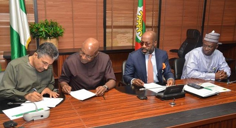 L-R: CEO of SEEPCO, Mr. Deepak Babubhai; Chairman of SEEPCO, Mr. Tony Chukwueke; rep. of NNPC GMD & NNPC COO, Upstream, Mr. Roland Ewubare; & Managing Director of NPDC, Mr. Mansur Sambo, signing Financing & Technical Services Agreement at the NNPC HQ