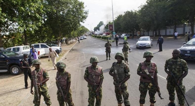 Nigerian army soldiers stand guard in Abuja June 25, 2014. 