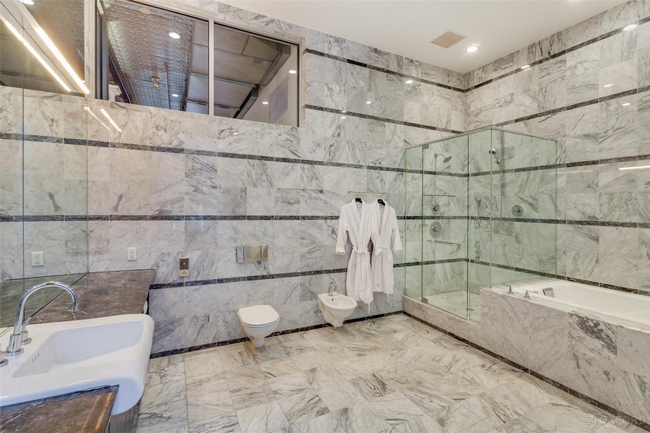 In the giant marble bathroom, you'll even find his-and-hers robes.