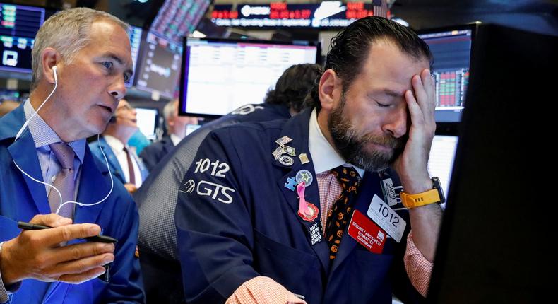 Traders work on the floor at the New York Stock Exchange (NYSE) in New York, U.S., October 31, 2019. REUTERS/Brendan McDermid