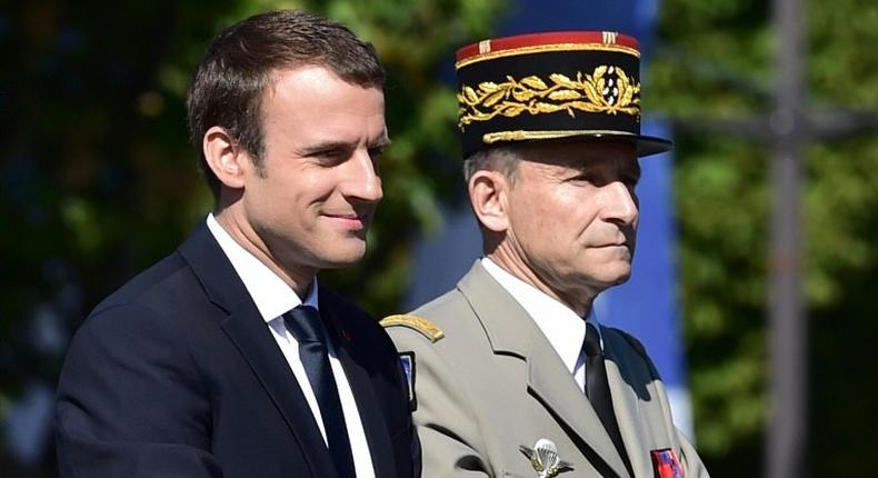 French President Emmanuel Macron (left) and outgoing armed forces chief General Pierre de Villiers, pictured during the annual Bastille Day military parade in Paris on July 14, 2017