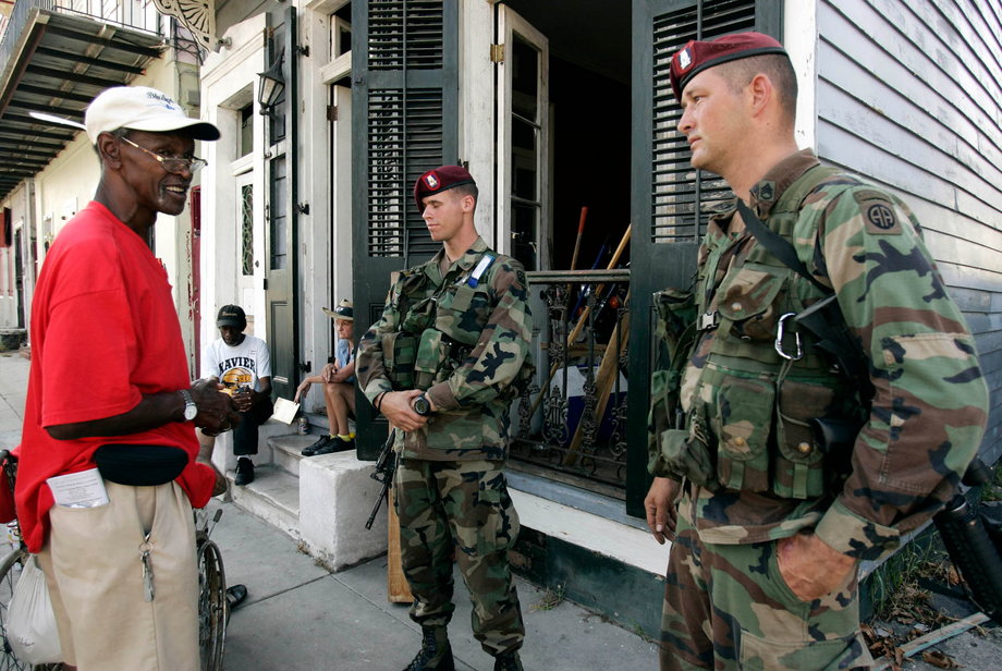 Members of the National Guard talk to Hurricane Katrina holdouts in New Orleans on September 11, 2005.