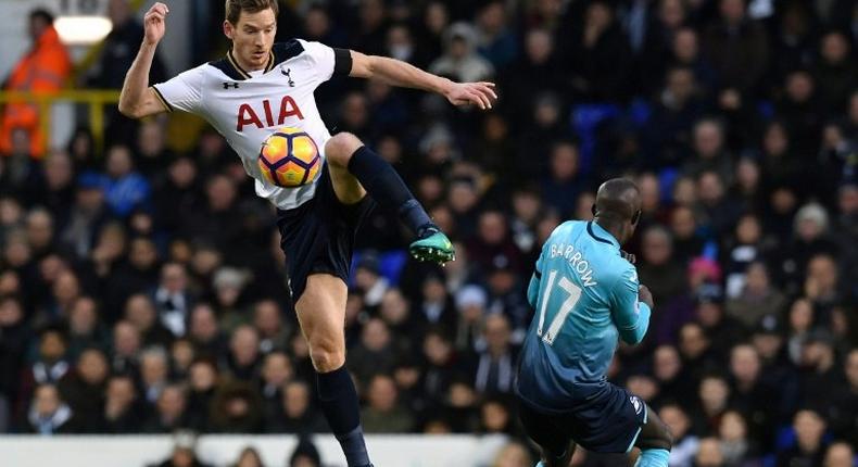 Tottenham Hotspur's Jan Vertonghen kicks the ball past Swansea City's Modou Barrow during the match at White Hart Lane in London, on December 3, 2016