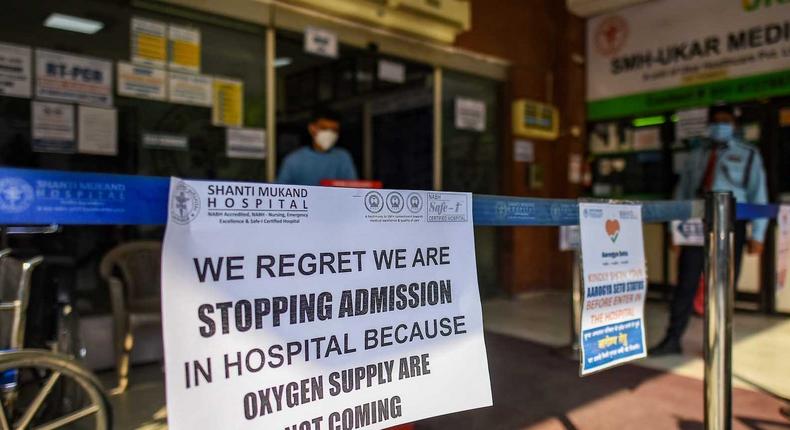 A public notice hangs outside Shanti Mukund Hospital notifying a shortage of oxygen, on April 22 in New Delhi, India.
