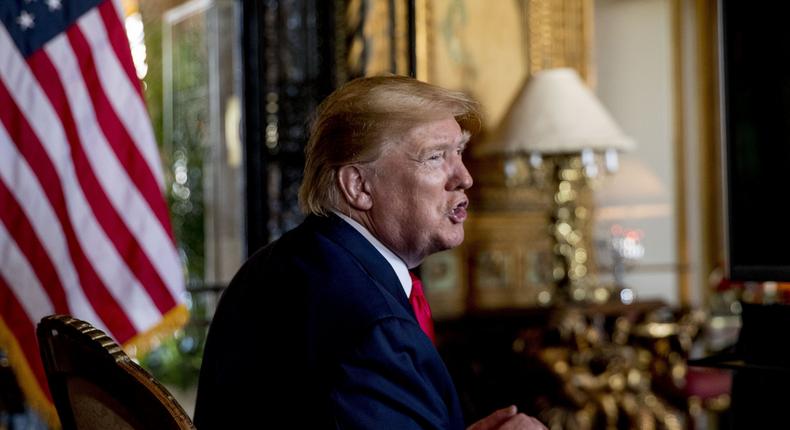 FILE - In this Dec. 24, 2019 photo, President Donald Trump speaks to members of the media following a Christmas Eve video teleconference with members of the military at his Mar-a-Lago estate in Palm Beach, Fla. Trump says Iranian Gen. Qassem Soleimani, the target of a Friday U.S. airstrike in Iraq was