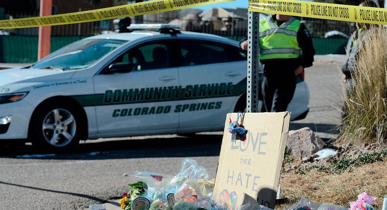 A bouquet of flowers is left near Club Q, an LGBTQ nightclub in Colorado Springs, Colorado, on November 20, 2022.(Photo by Jason Connolly / AFP)