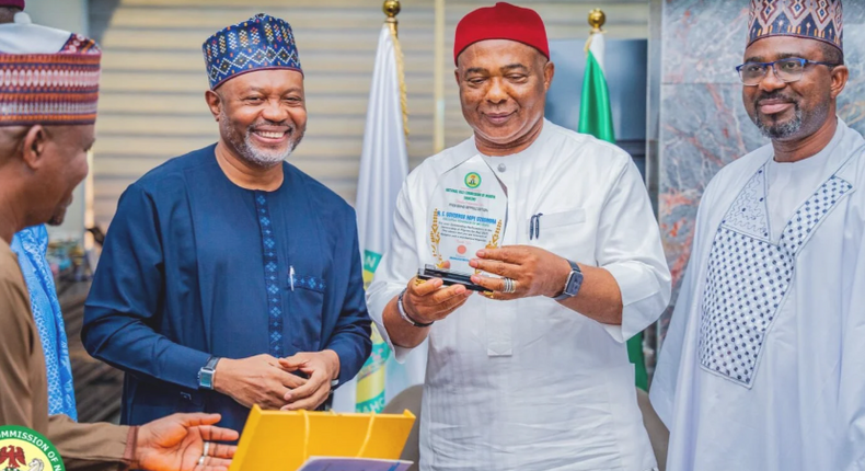 NAHCON officials with Imo State Governor, Hope Uzodinma holding the award presented to him. [NAN]