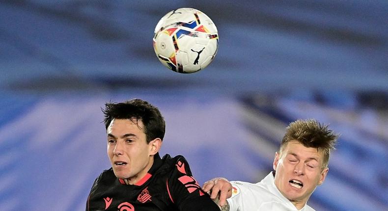 Toni Kroos (R) heads the ball with Real Sociedad's Spanish midfielder Martin Zubimendi during Monday's 1-1 draw