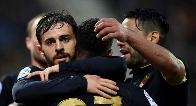 Monaco's Bernardo Silva (L) celebrates with teammates after scoring a goal against Nancy during their French Ligue 1 football match on May 6, 2017 in Tomblaine, eastern France