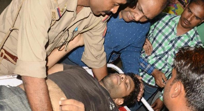 An Indian man injured in clashes between different castes is brought to a hospital in the Saharanpur district of Uttar Pradesh, on May 24, 2017