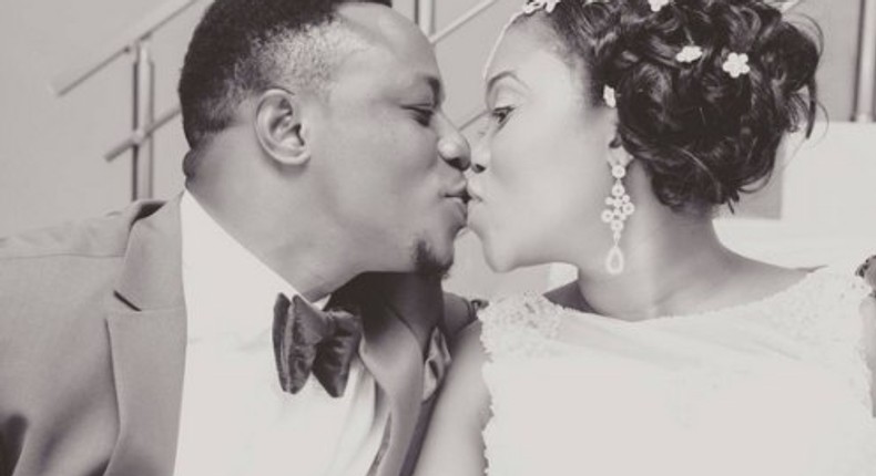 Chuddy K kissing his wife 