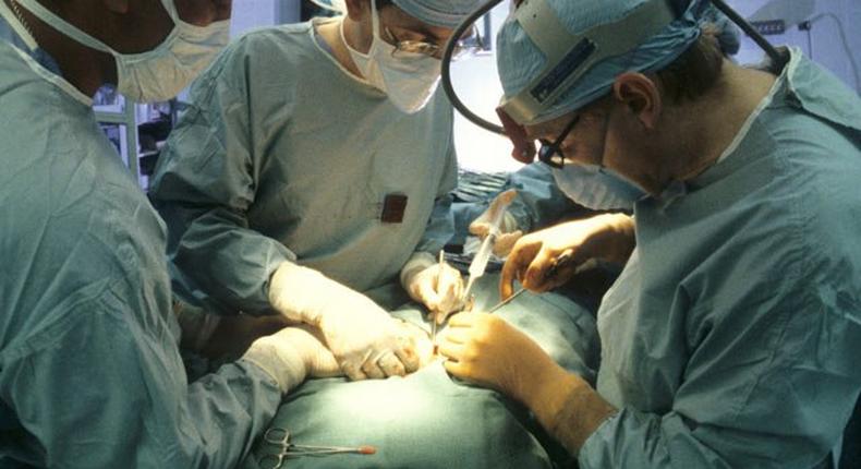 Surgeons performing a kidney transplant