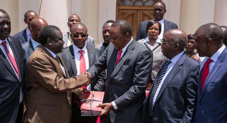 President Uhuru Kenyatta receives the miraa Task Force report at State House, Nairobi.