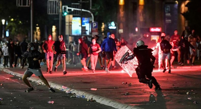 Police clash with protesters near the   National Assembly building in Belgrade, on July 10, 2020, at a demonstration against a weekend curfew announced to combat a resurgence of COVID-19 infections