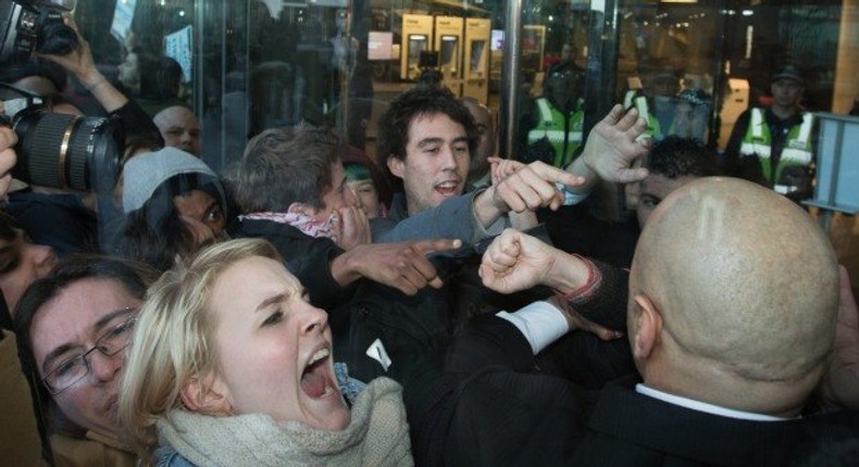 Demonstrators clash with police outside NAB headquarters in Melbourne's Docklands.