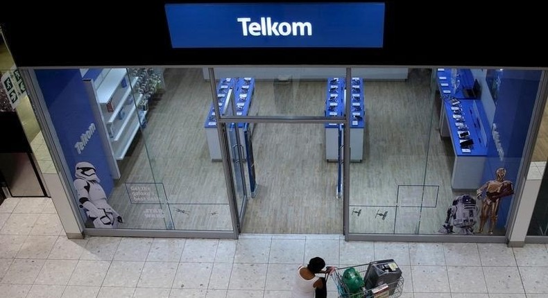 A shopper walks past a Telkom shop at a mall in Johannesburg February 26, 2016. 