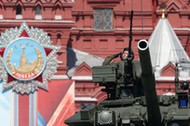 Russian servicemen drive T-90A main battle tank during Victory Day parade to mark end of World War T